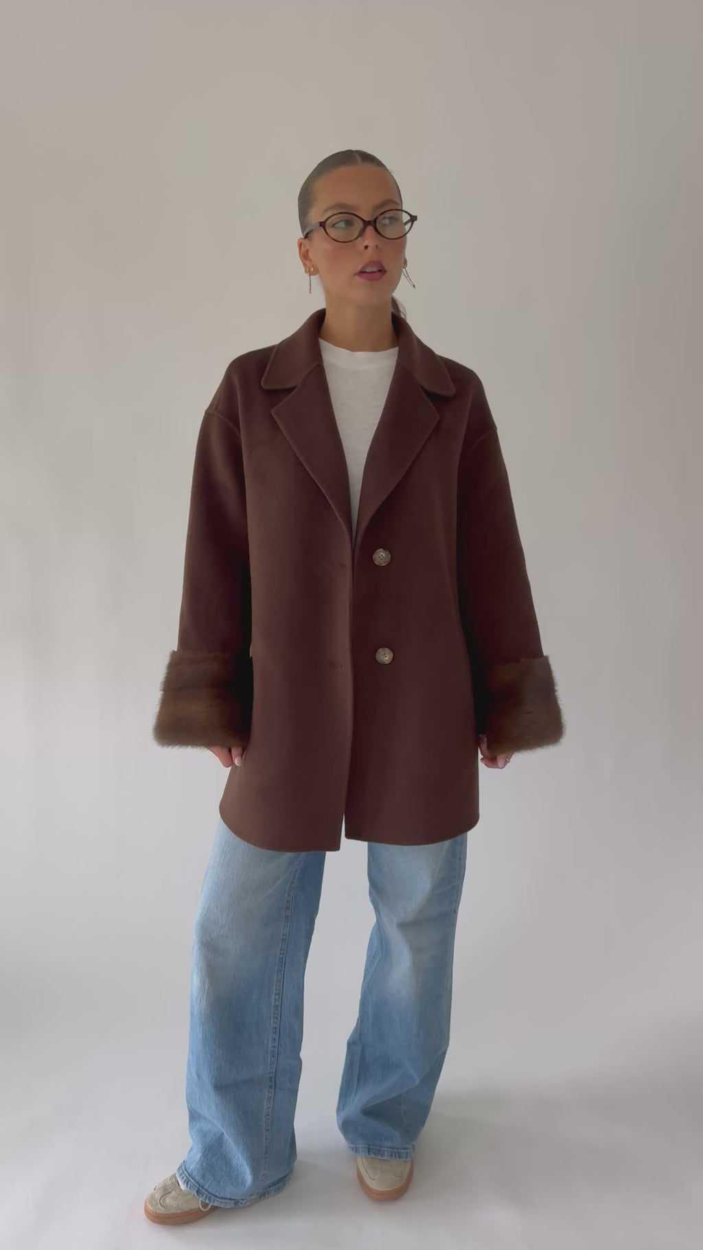 chocolate brown cashmere coat with mink fur details on the sleeves 