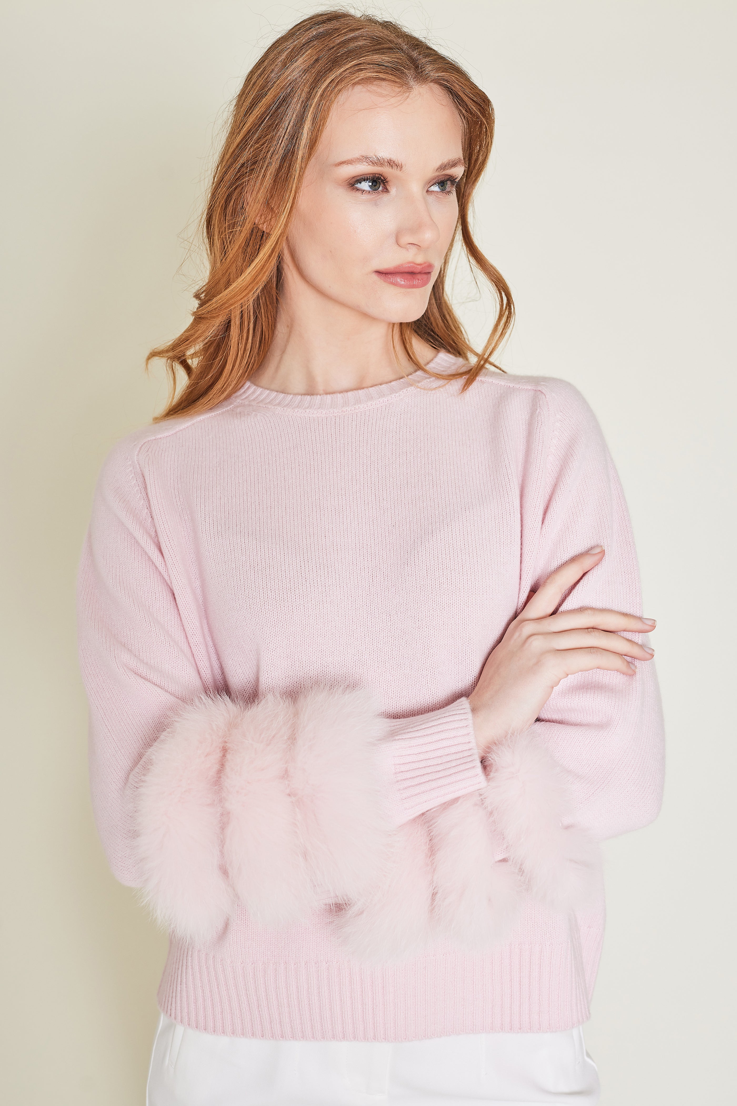 cashmere sweater with fox fur on sleeves in pink